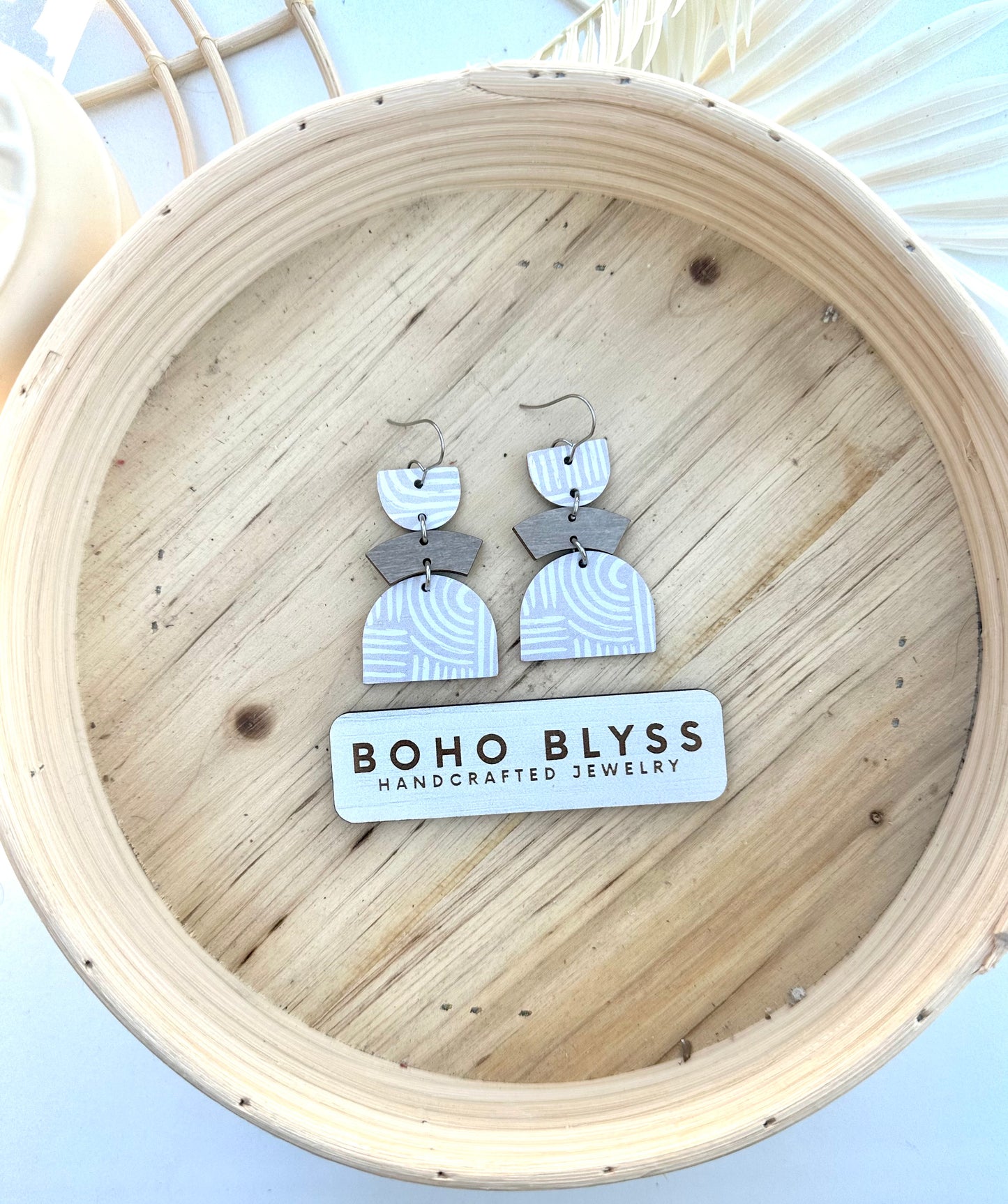 Gray and white arch dangles