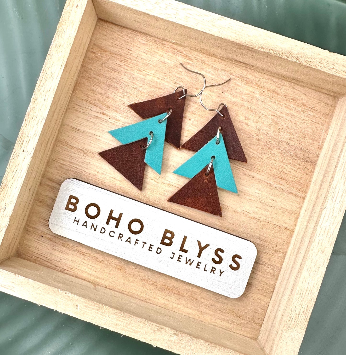 Brown and turquoise stacked triangles