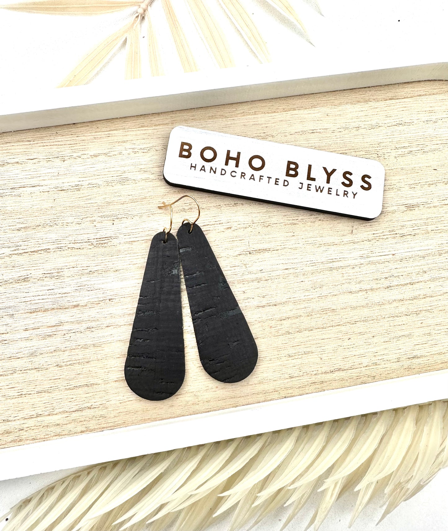 Black elongated teardrops